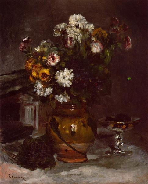 Blumen in einer Vase und einem Glas Champagner.