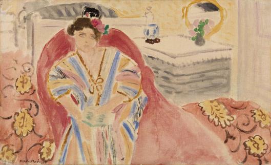 Femme sur un canapé rouge 1920