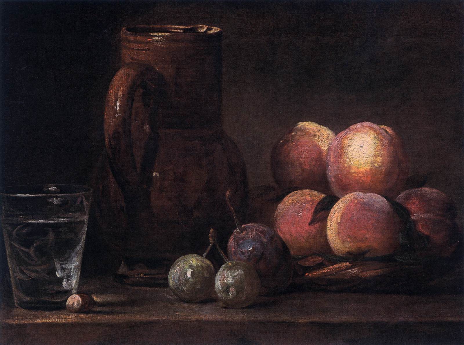 Frutta, brocca e un bicchiere