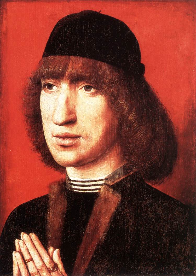 Porträtt av en ung man i bön