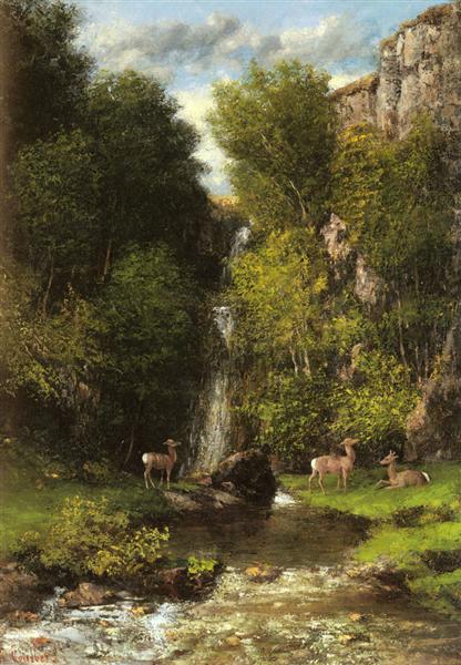 A family of deer in a landscape with a waterfall.