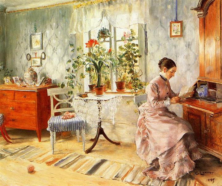 Un intérieur avec une femme lisant.