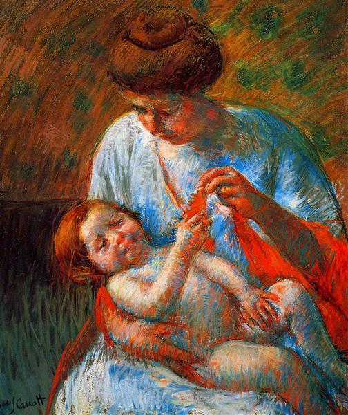 Baby lying on his mother's lap - reaching to hold a scarf - 1914