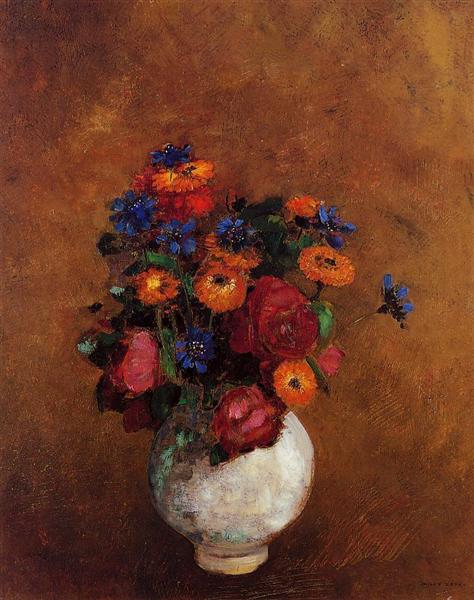 Bouquet of flowers in a white vase.