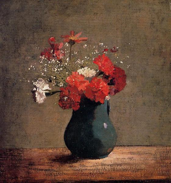 Carnations and baby's breath in a green jar.