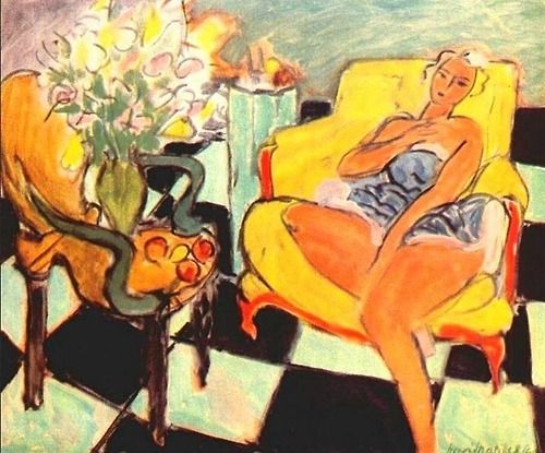 1942年の花と一緒に座っている女性