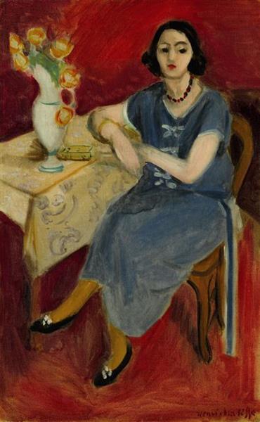 Woman in blue at a table red background 1923 