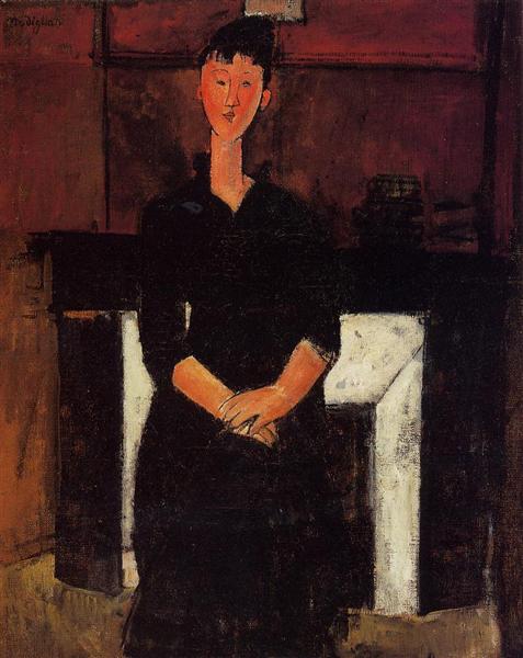 Woman sitting next to a fireplace - 1915