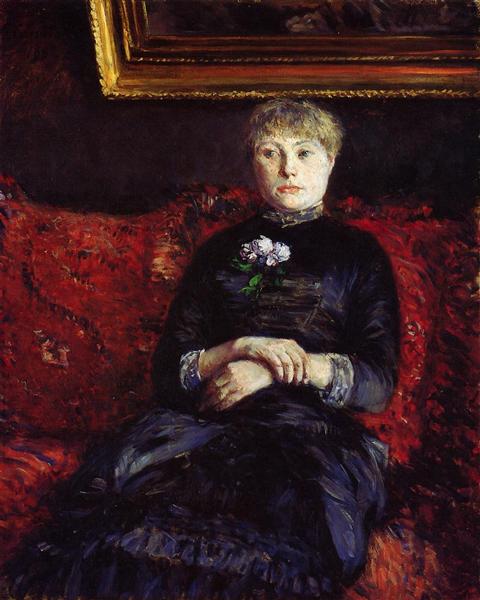 Kvinde, der sidder på en rød blomster sofa - 1880