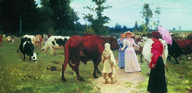 The ladies walk between a herd of cows