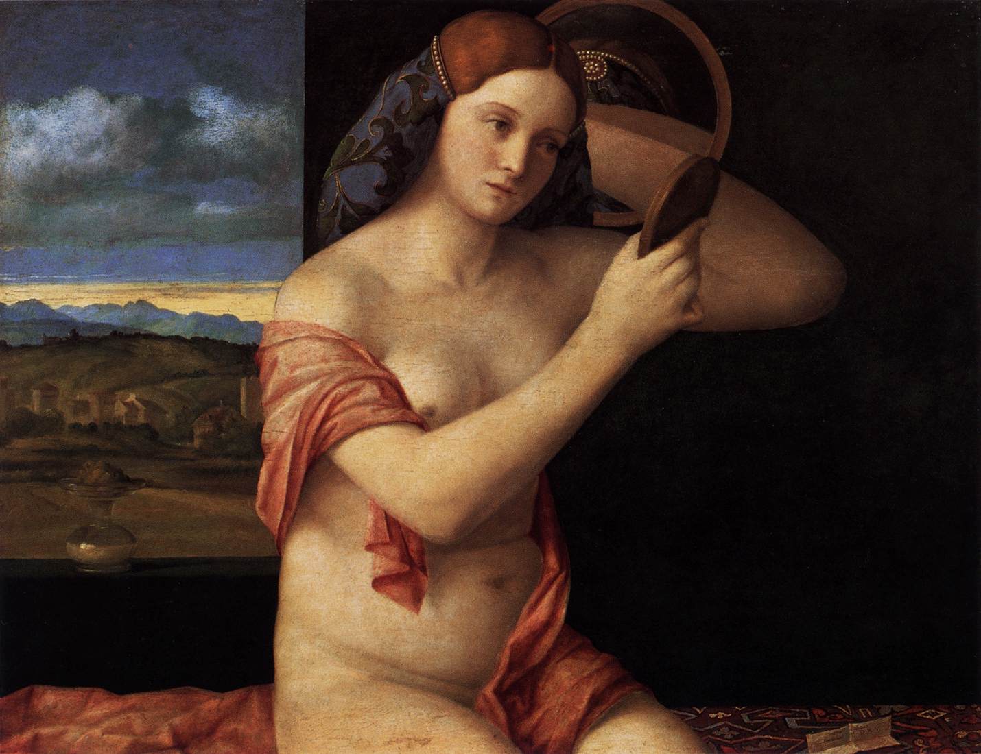 Giovane donna nuda davanti allo specchio