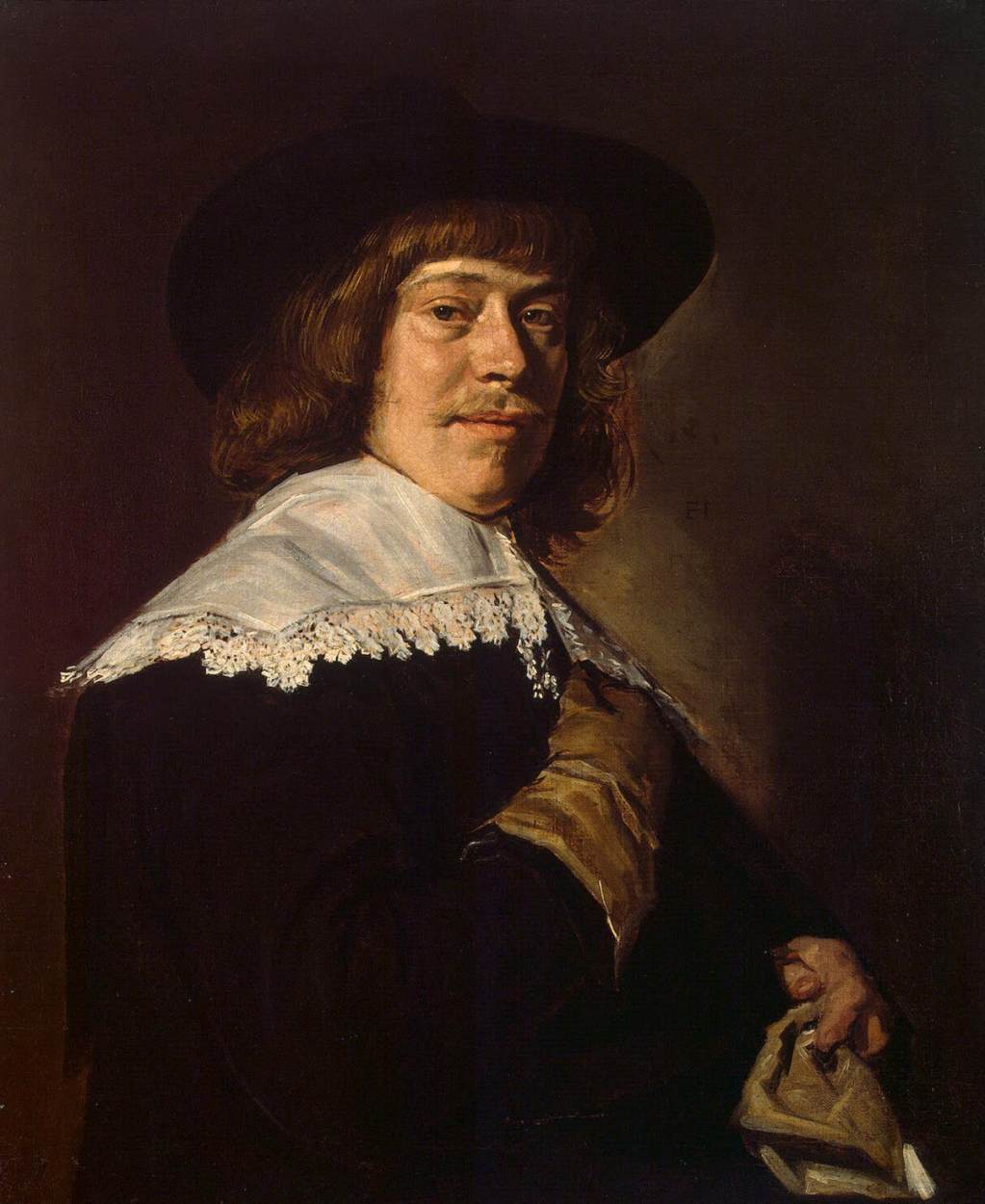 Portret van een jonge man met een handschoen