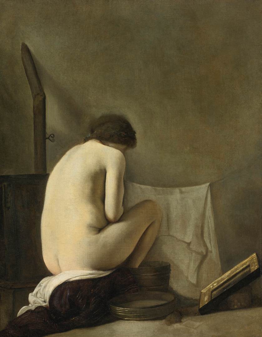 Bagno nudo seduto vicino a una stufa