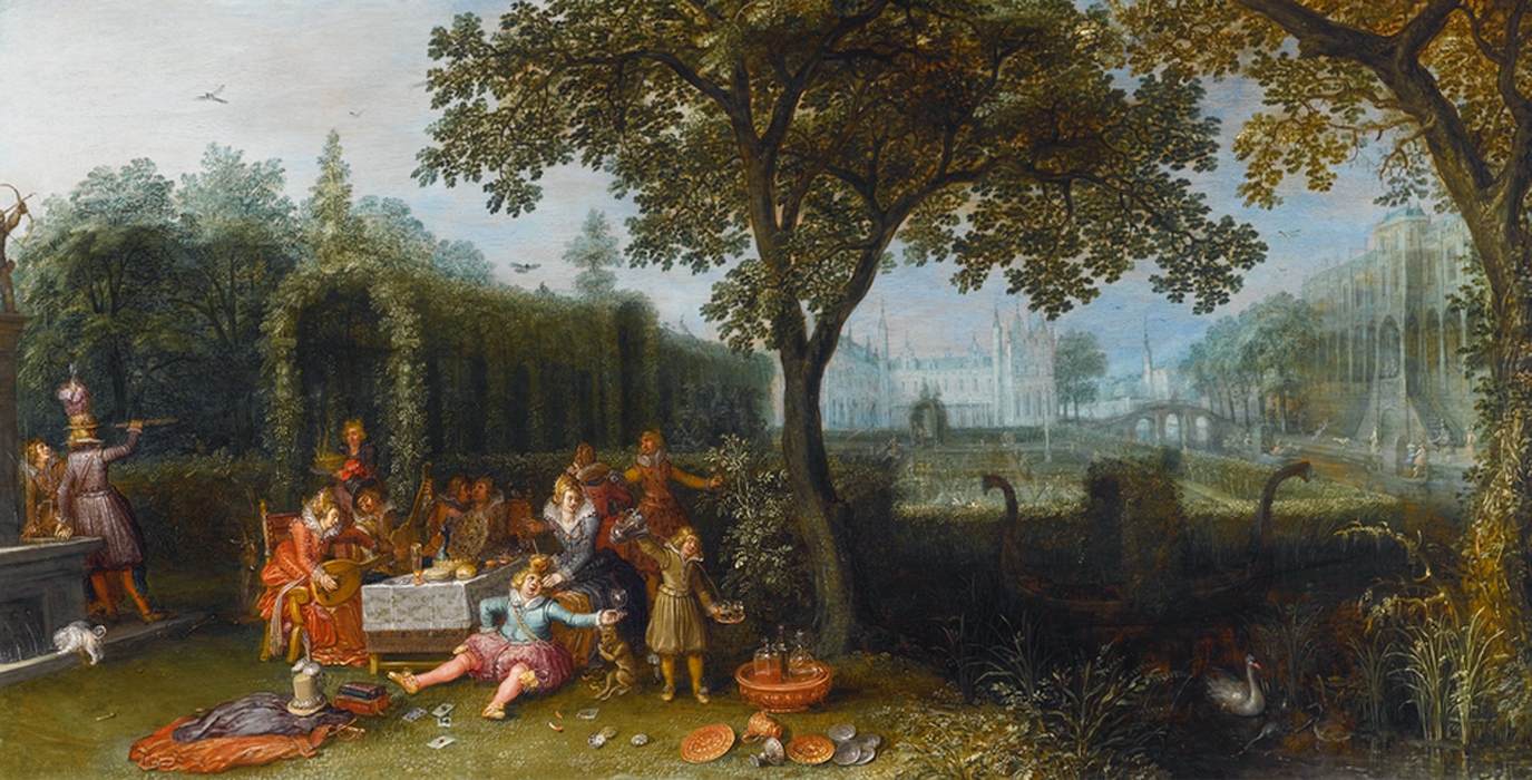 Grupo elegante em um jardim ornamentado do palácio