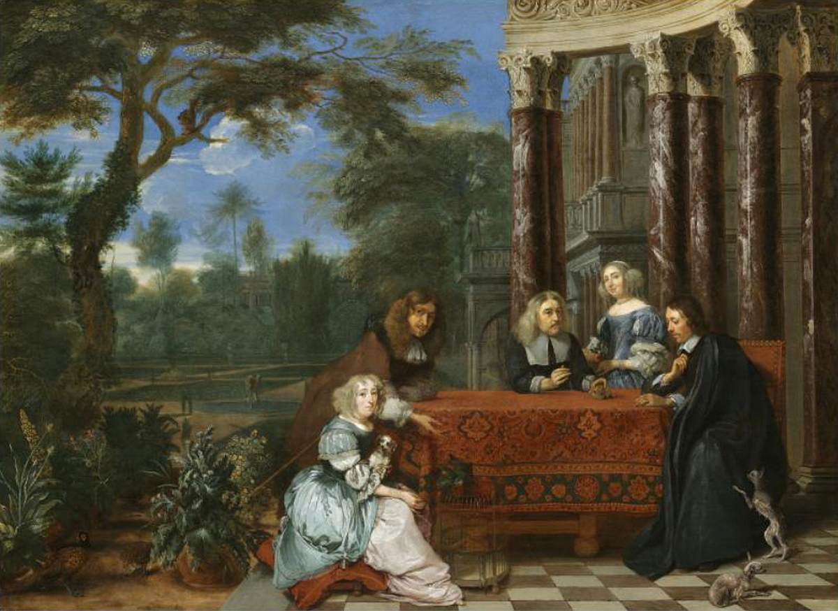 Famille assise à une table dans un jardin élégant à l'extérieur