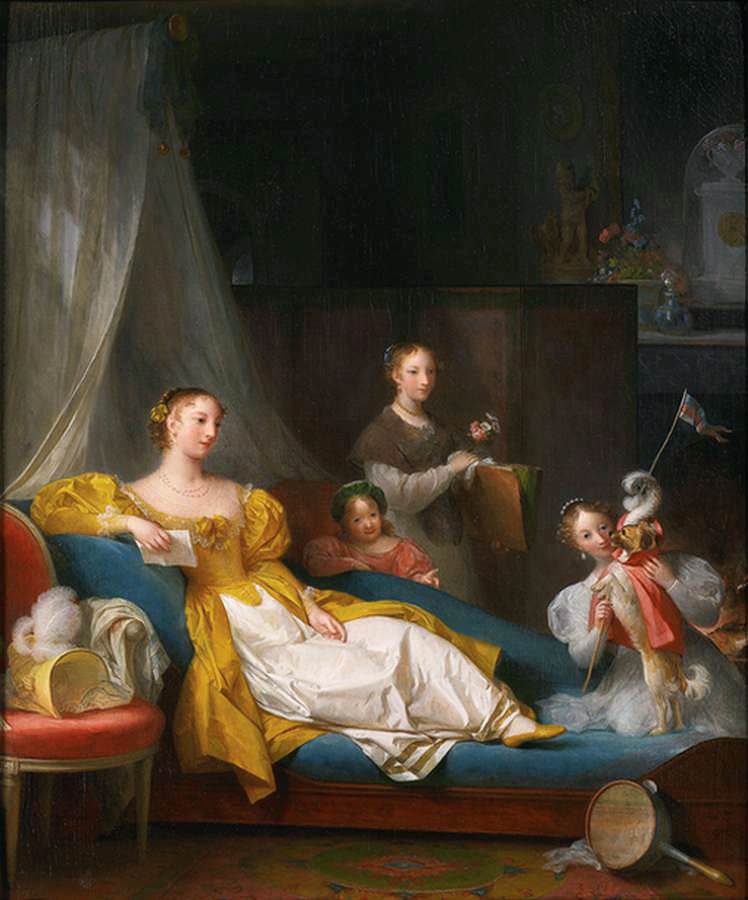 A Family in an Indoor Playing with a Dog