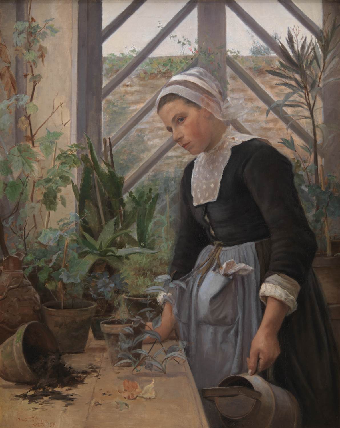 Breton Girl prenant en charge les plantes dans la serre