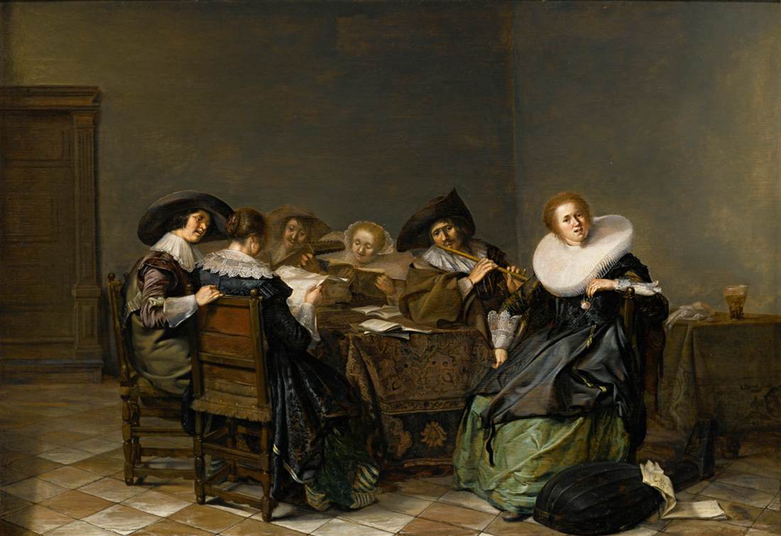 Interior com músicos sentados ao redor de uma mesa