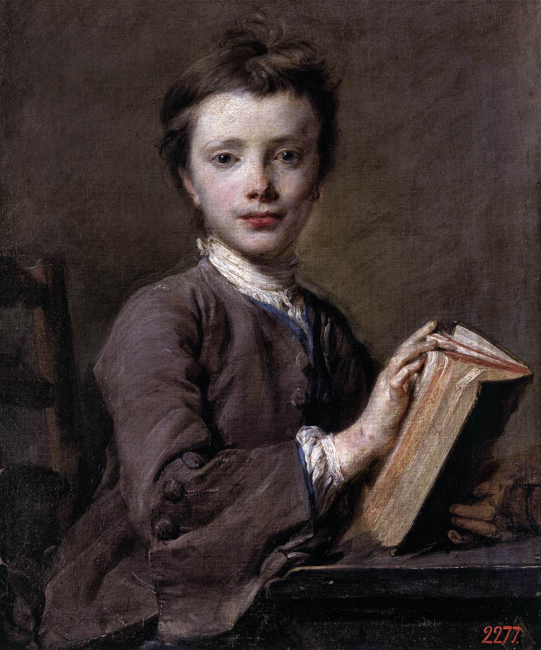 Portræt af et barn med en bog