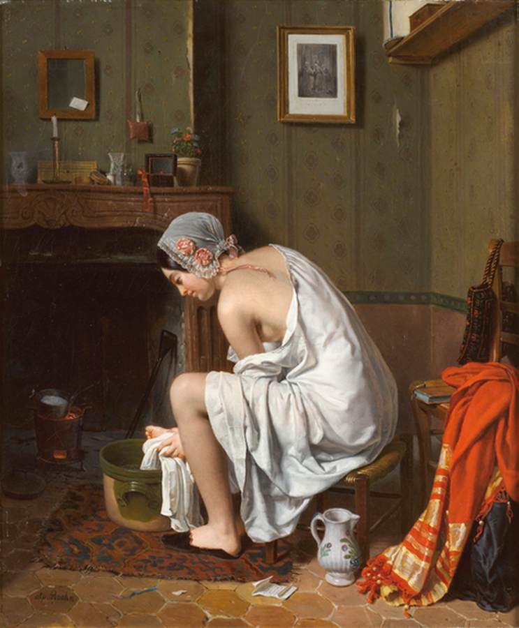 Jeune femme dans sa salle de bain