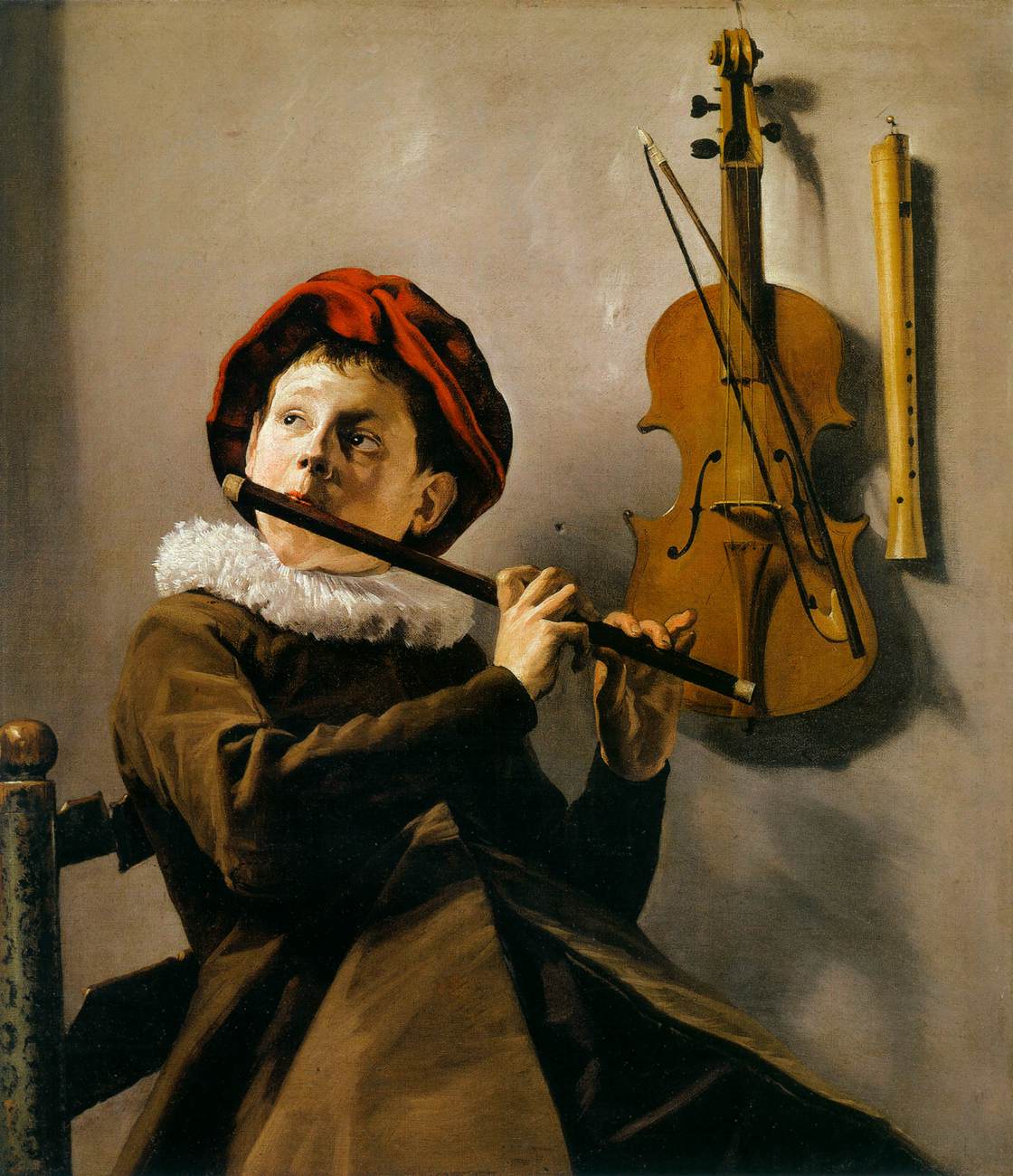 Bir flüt oynayan çocuk